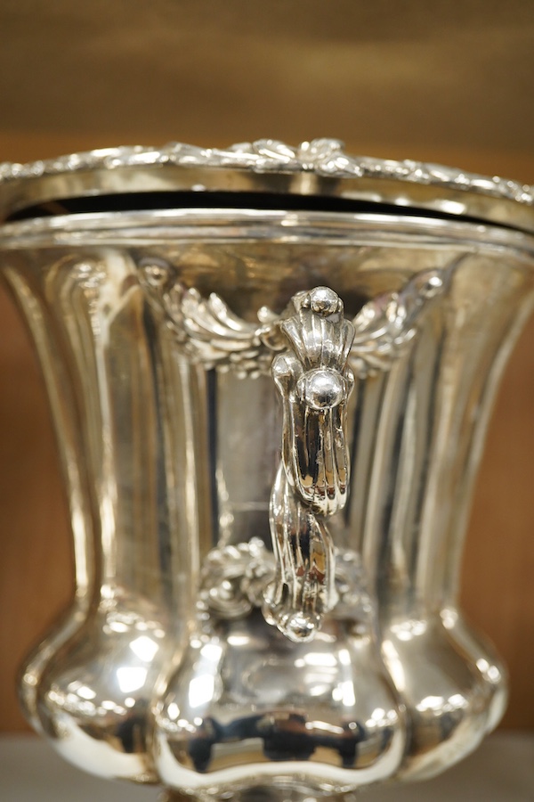 A pair of Old Sheffield plate two handled plated wine coolers, with later associated liners, 26cm high. Condition - fair